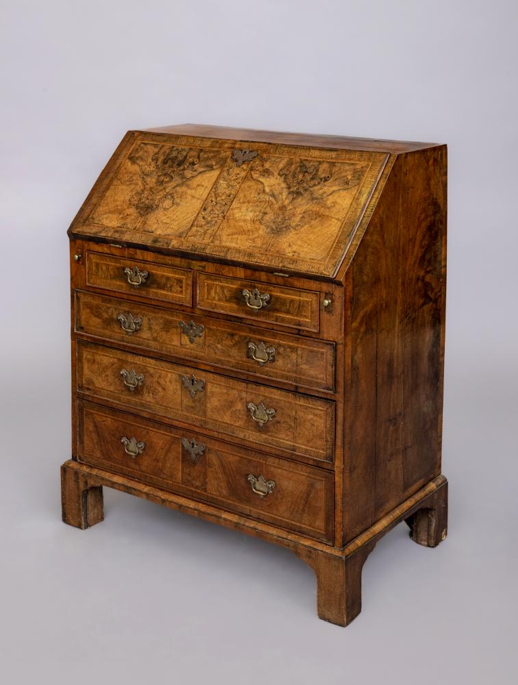 A GEORGIAN BURR WALNUT AND FEATHER BANDED BUREAU Image