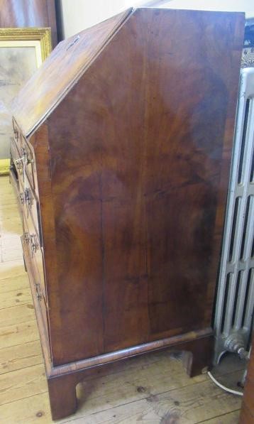A GEORGIAN BURR WALNUT AND FEATHER BANDED BUREAU Image