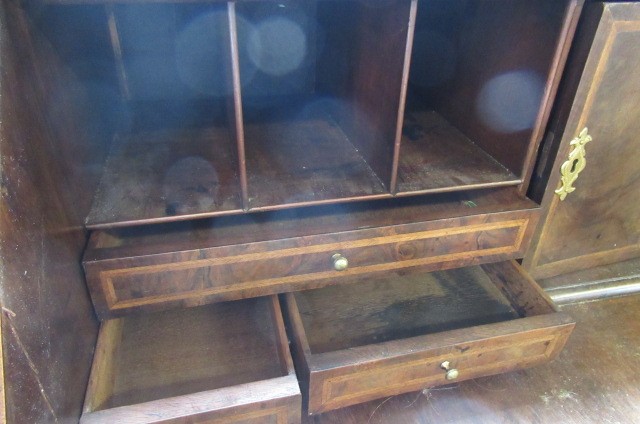 A GEORGIAN BURR WALNUT AND FEATHER BANDED BUREAU Image