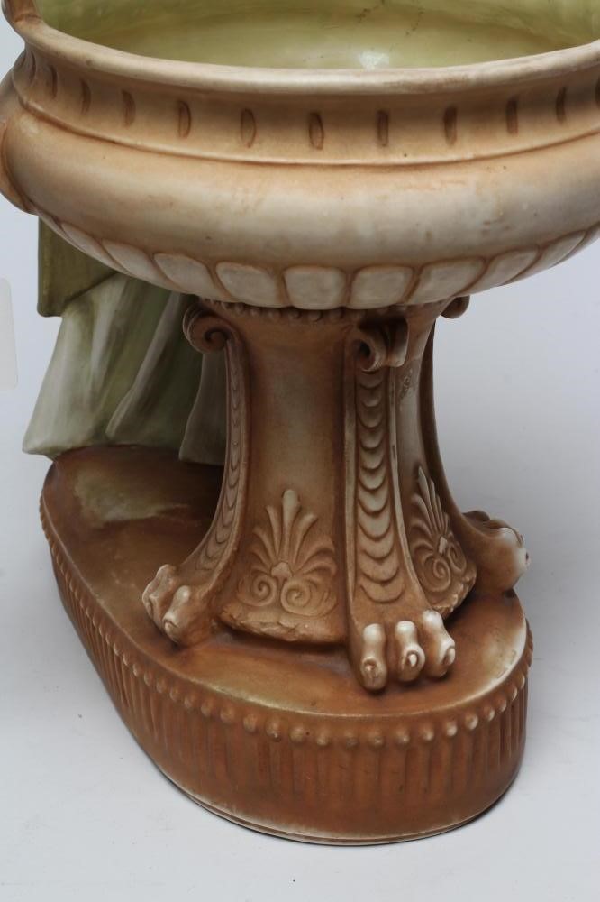 AN AMPHORA PORCELAIN FIGURAL TABLE CENTREPIECE Image