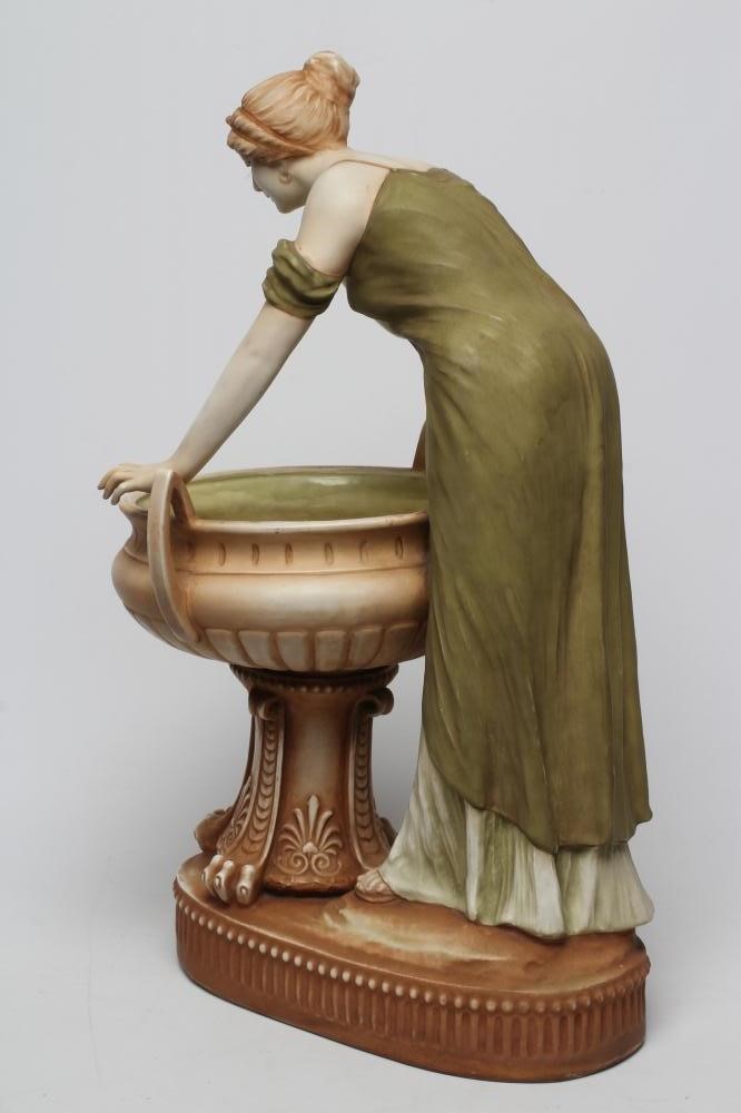 AN AMPHORA PORCELAIN FIGURAL TABLE CENTREPIECE Image
