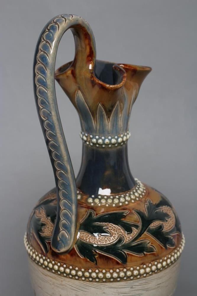 A LATE VICTORIAN DOULTON LAMBETH STONEWARE EWER BY HANNAH BARLOW of ovoid form with high loop handle Image