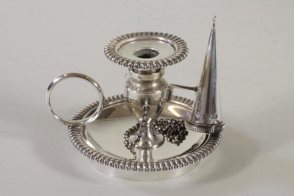 AN EDWARDIAN SILVER CHAMBERSTICK WITH EXTINGUISHER Image