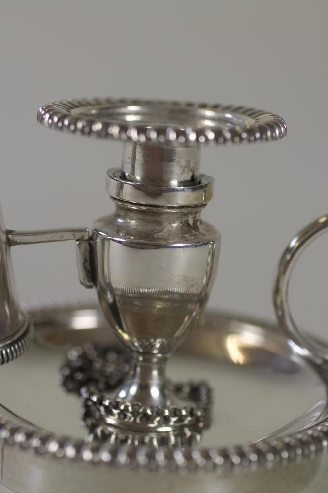 AN EDWARDIAN SILVER CHAMBERSTICK WITH EXTINGUISHER Image