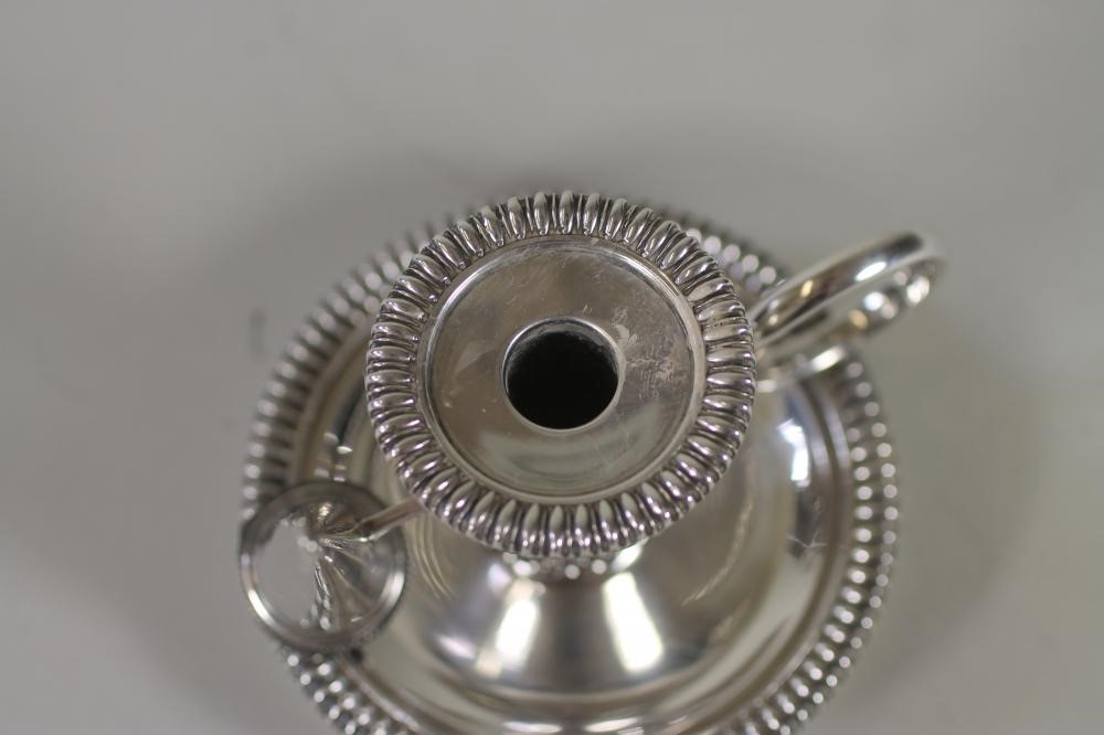 AN EDWARDIAN SILVER CHAMBERSTICK WITH EXTINGUISHER Image