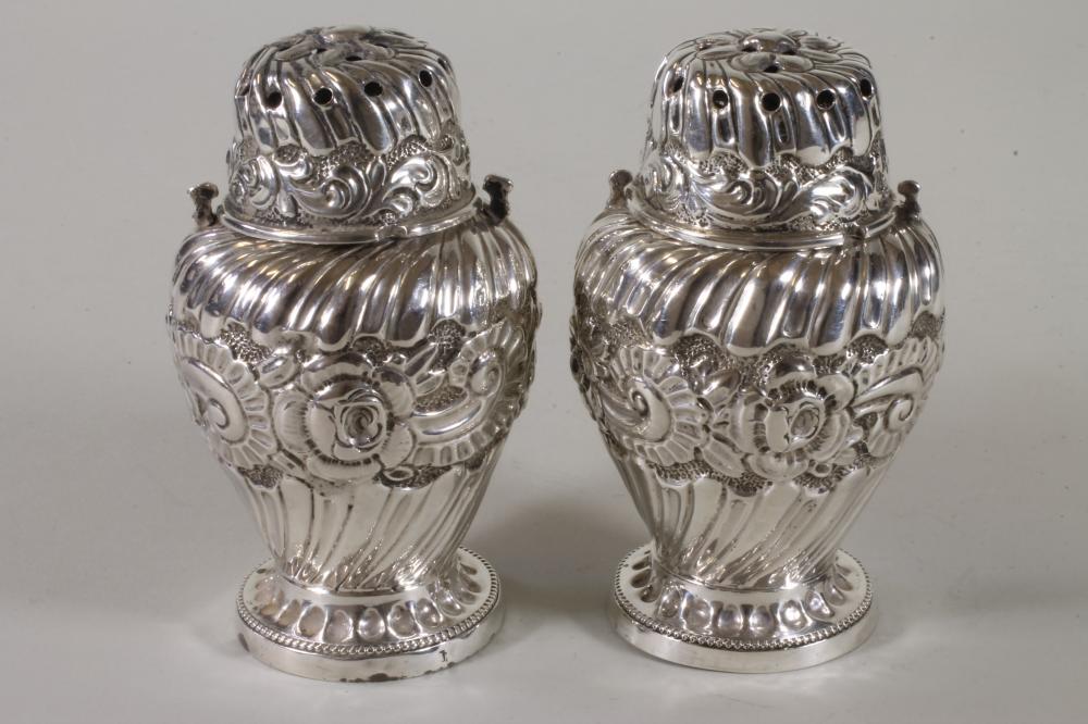 A PAIR OF LATE VICTORIAN SILVER SUGAR CASTORS Image