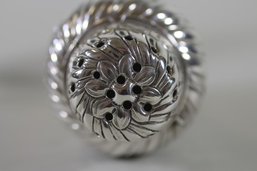 A PAIR OF LATE VICTORIAN SILVER SUGAR CASTORS Image