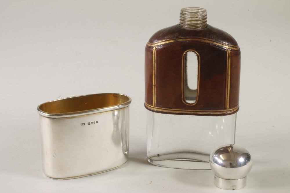 A VICTORIAN GLASS AND SILVER HIP FLASK Image