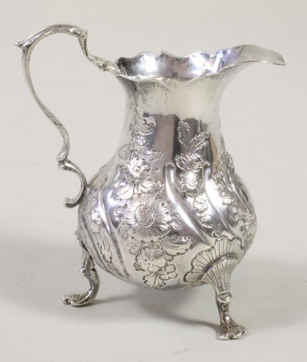 A GEORGE III SILVER MILK JUG Image