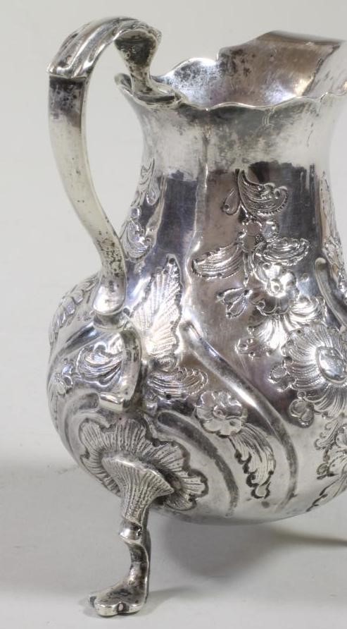 A GEORGE III SILVER MILK JUG Image