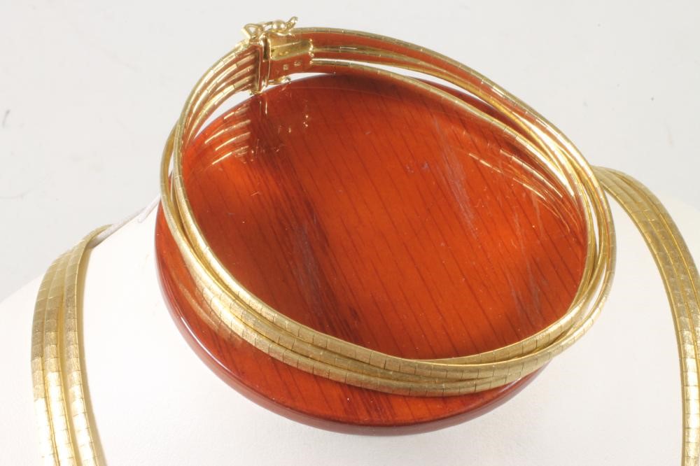 A 1960's 18K GOLD TRIPLE STRAND NECKLACE AND MATCHING BRACELET Image