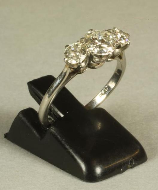 A THREE STONE DIAMOND RING Image