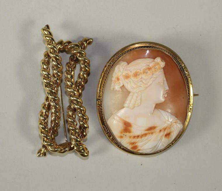 A VICTORIAN SHELL CAMEO BROOCH of oval form carved with the bust portrait of a young lady wearing a Image