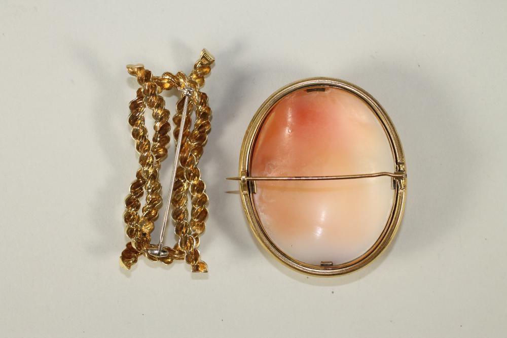 A VICTORIAN SHELL CAMEO BROOCH of oval form carved with the bust portrait of a young lady wearing a Image