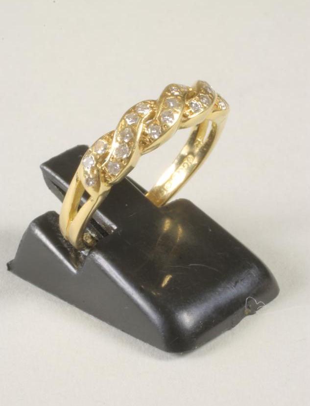 A DIAMOND SET HALF HOOP RING Image