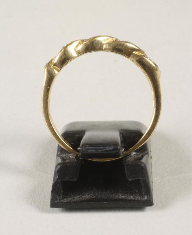 A DIAMOND SET HALF HOOP RING Image
