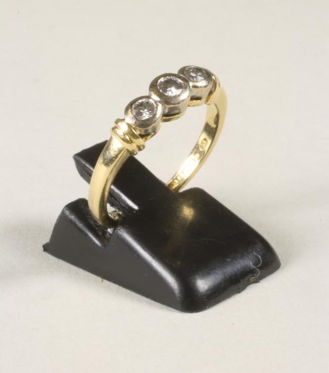 A THREE STONE DIAMOND RING Image