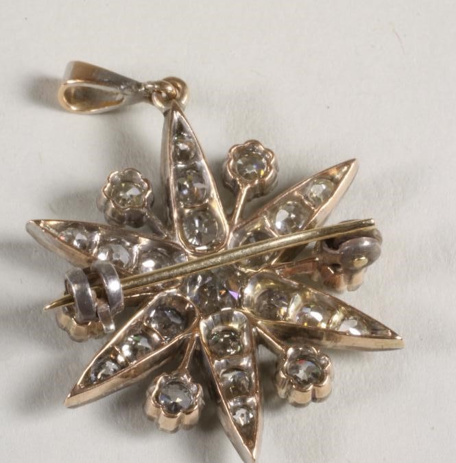 A DIAMOND STAR BROOCH/PENDANT Image