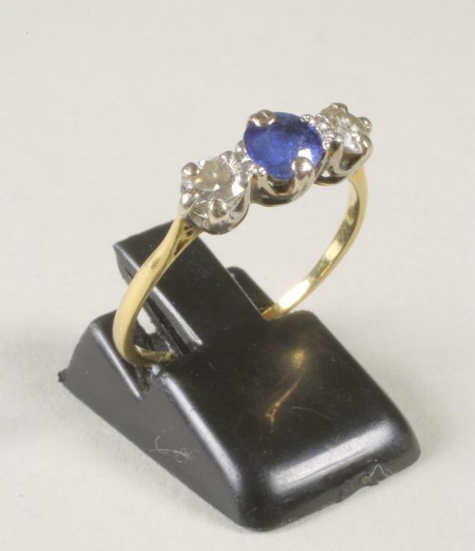 A THREE STONE SAPPHIRE AND DIAMOND RING Image