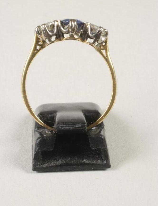 A THREE STONE SAPPHIRE AND DIAMOND RING Image