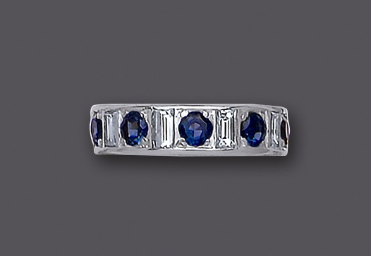 A SAPPHIRE AND DIAMOND HALF HOOP ETERNITY RING Image