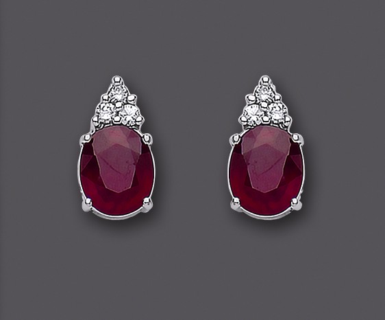 A PAIR OF RUBY AND DIAMOND EAR STUDS Image
