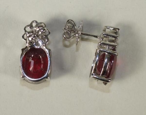 A PAIR OF RUBY AND DIAMOND EAR STUDS Image