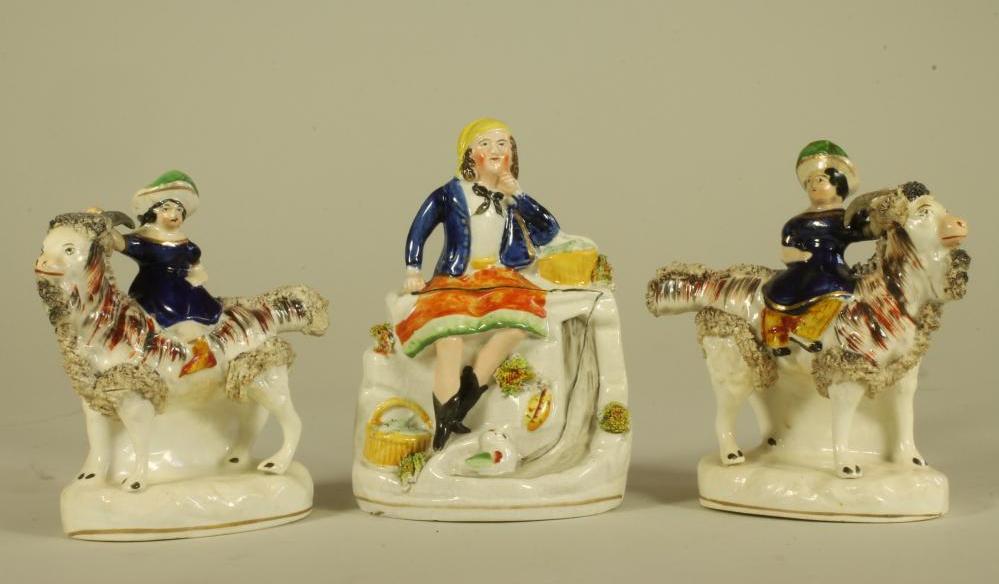 A PAIR OF VICTORIAN STAFFORDSHIRE POTTERY FIGURES Image