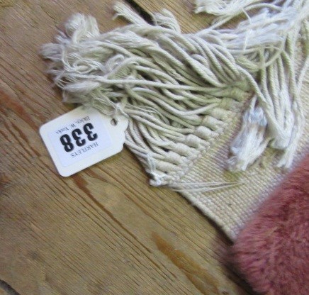 A CHINESE WASHED AND FRINGED AUBUSSON DESIGN CARPET with cream floral medallion and borders on a Image