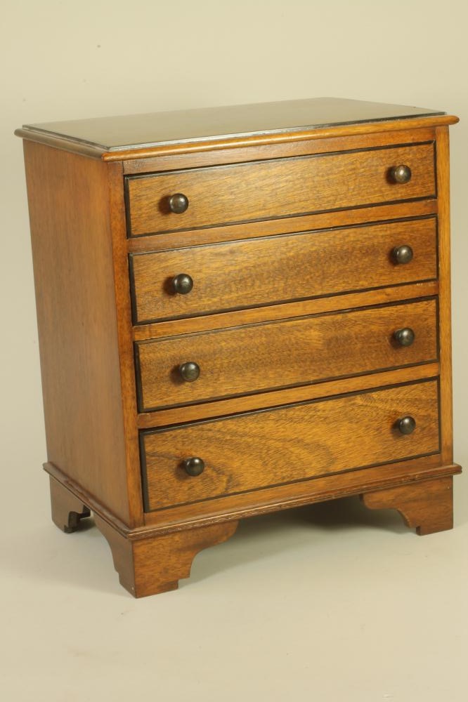 A MAHOGANY MINIATURE CHEST Image
