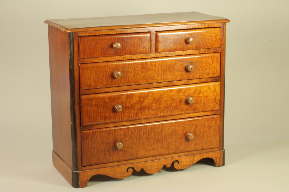 A VICTORIAN MAHOGANY MINIATURE CHEST of rounded oblong form Image