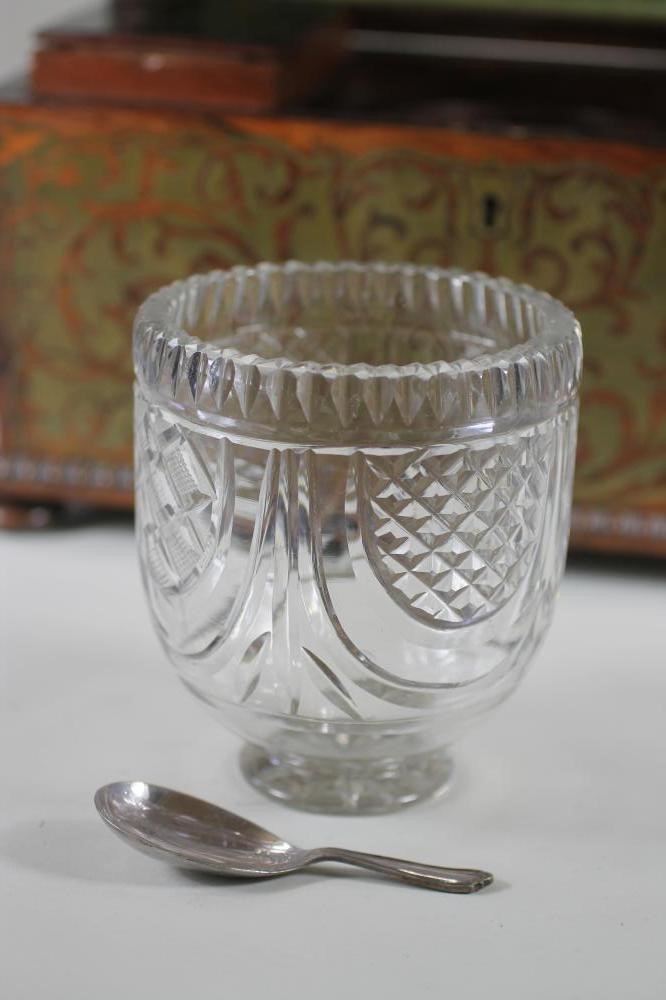 A REGENCY ROSEWOOD TEA CADDY of sarcophagus form with ring handles and raised upon four bun feet Image