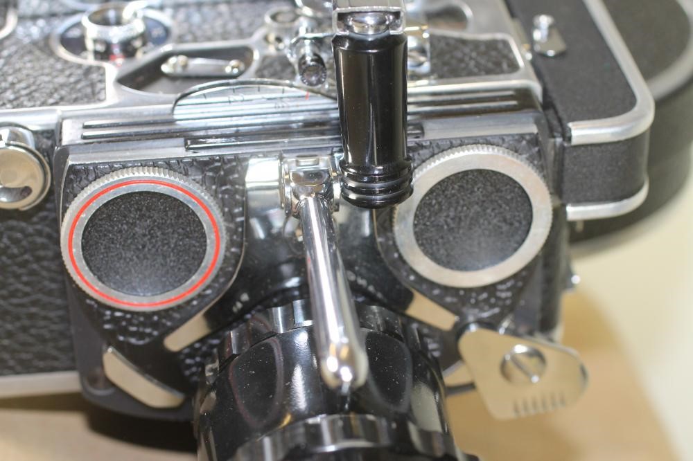 A PAILLARD BOLEX H16 REFLEX CAMERA with 150mm Kern Paillard lens in leather case Image