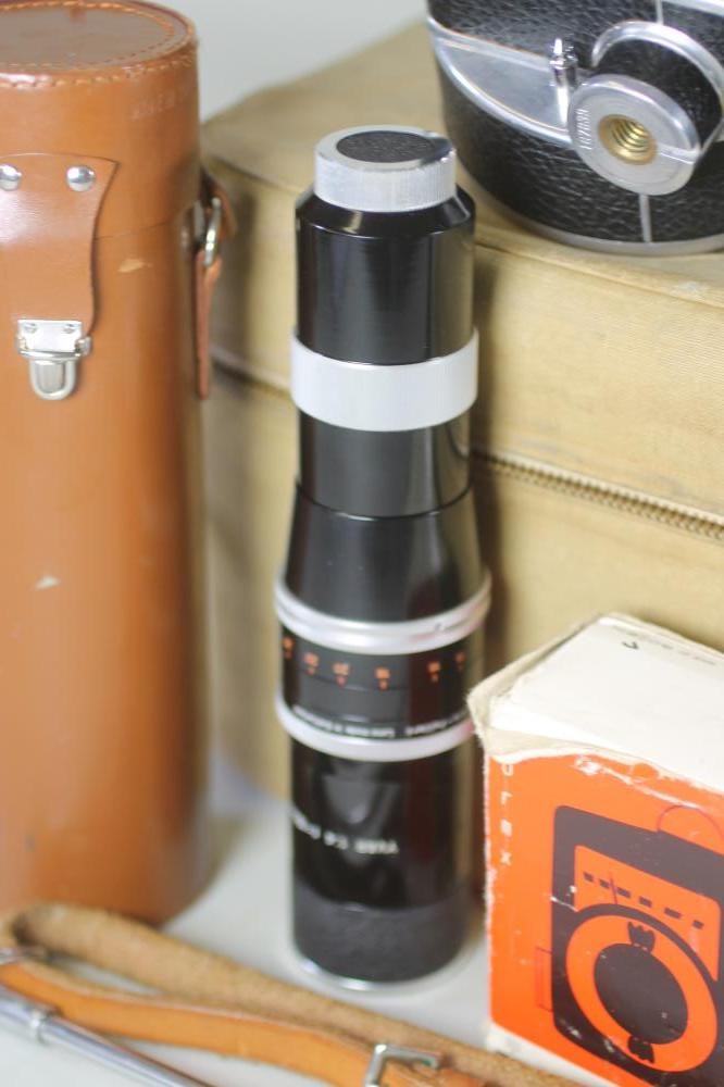 A PAILLARD BOLEX H16 REFLEX CAMERA with 150mm Kern Paillard lens in leather case Image