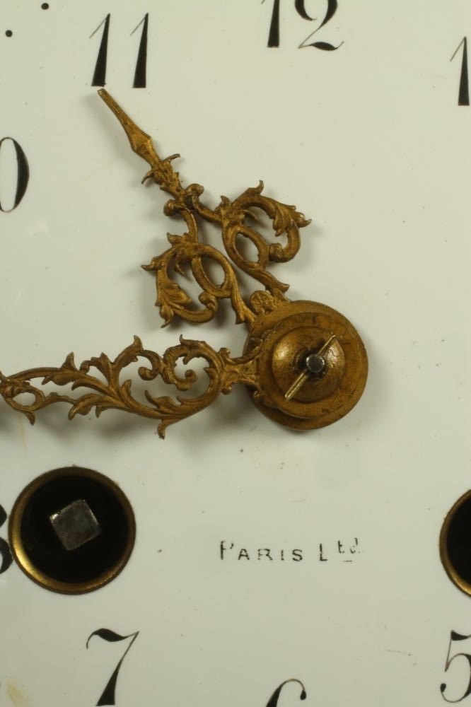 A FRENCH WHITE MARBLE AND GILT METAL MANTEL CLOCK Image