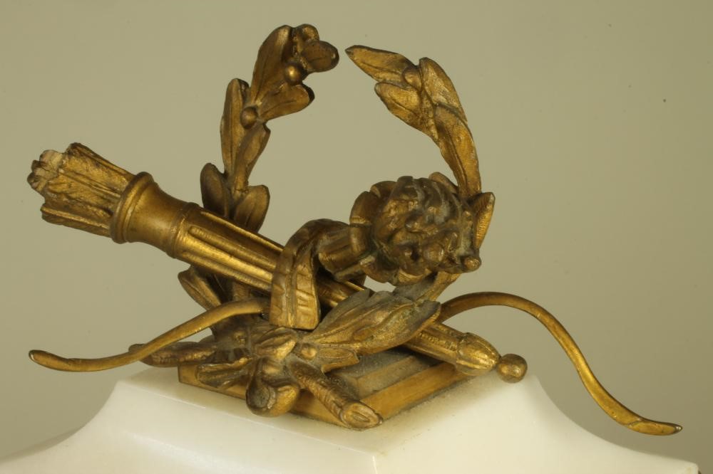 A FRENCH WHITE MARBLE AND GILT METAL MANTEL CLOCK Image