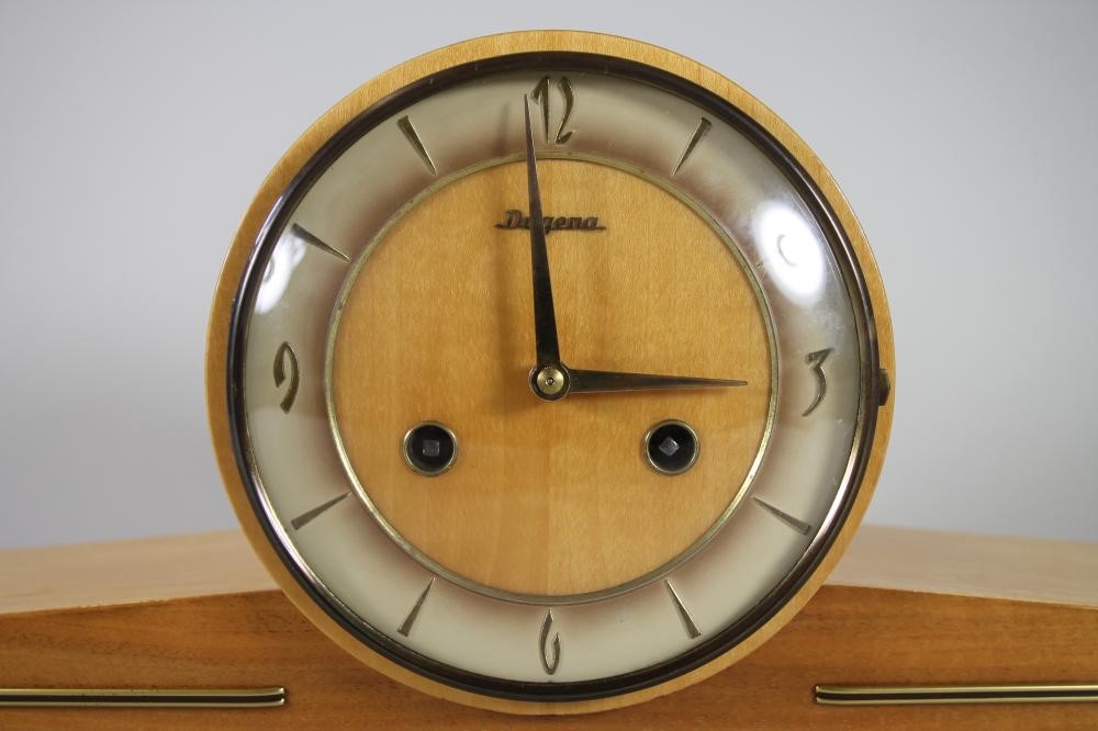 A SATINWOOD CASED GERMAN MANTEL CLOCK by Dugena Image