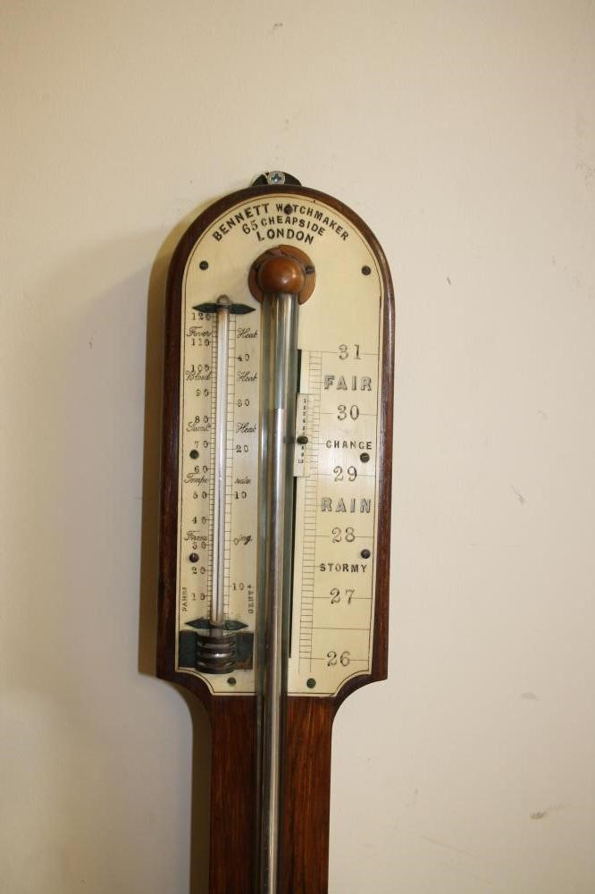 A ROSEWOOD STICK BAROMETER signed Bennett Image