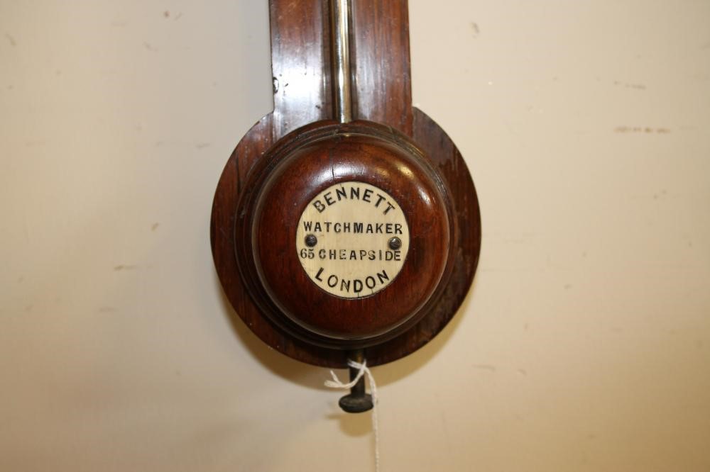 A ROSEWOOD STICK BAROMETER signed Bennett Image