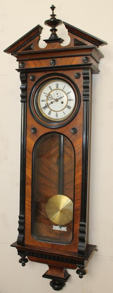 A GERMAN WALNUT CASED TIMEPIECE Image