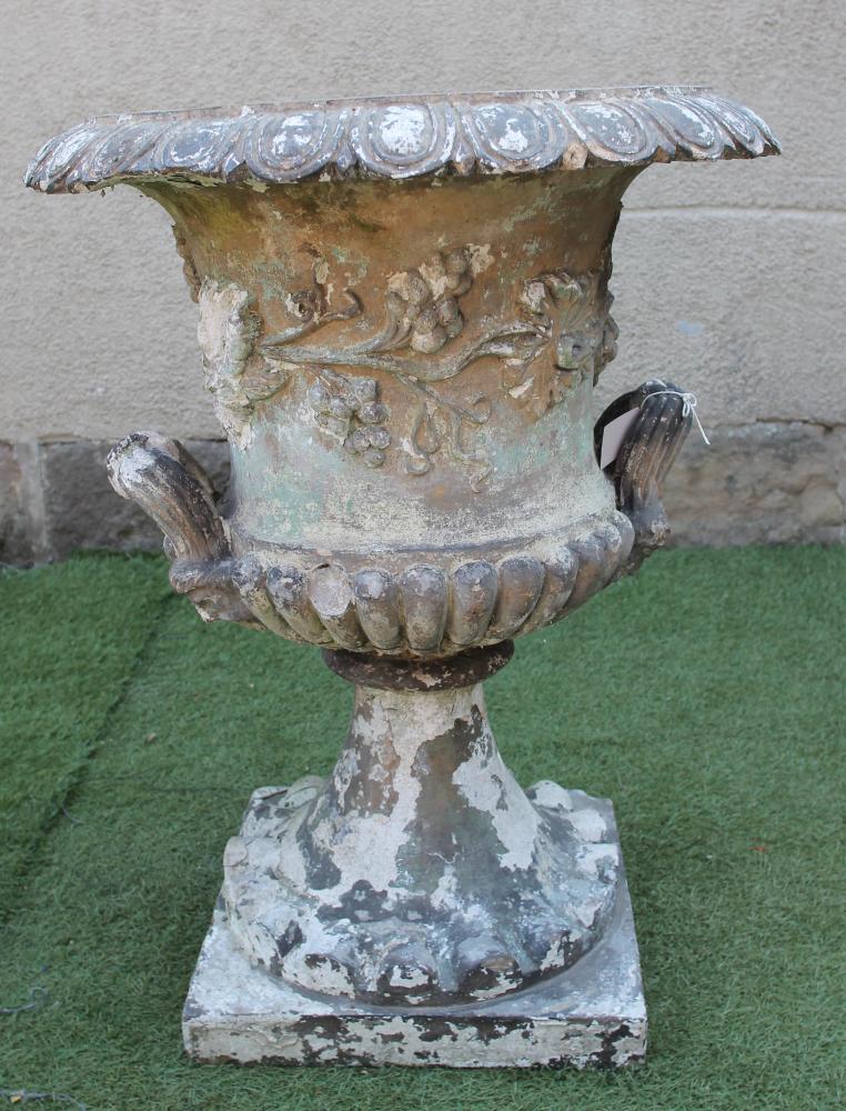 A VICTORIAN TERRACOTTA URN of half fluted campana form with egg and dart moulded rim Image