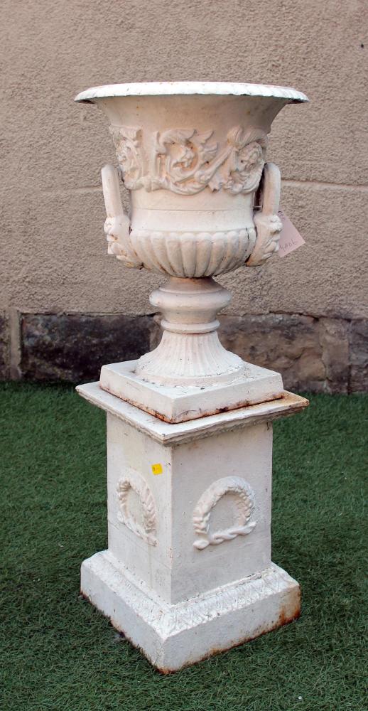 A VICTORIAN CAST IRON URN of half fluted campana form with beaded rim Image