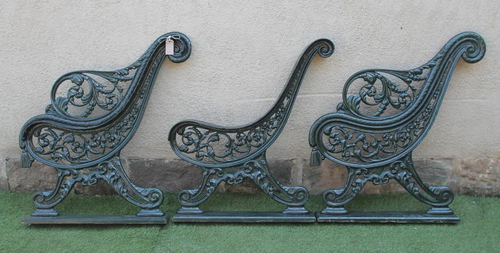 A PAIR OF VICTORIAN CAST IRON GARDEN BENCH ENDS of open scroll back form Image