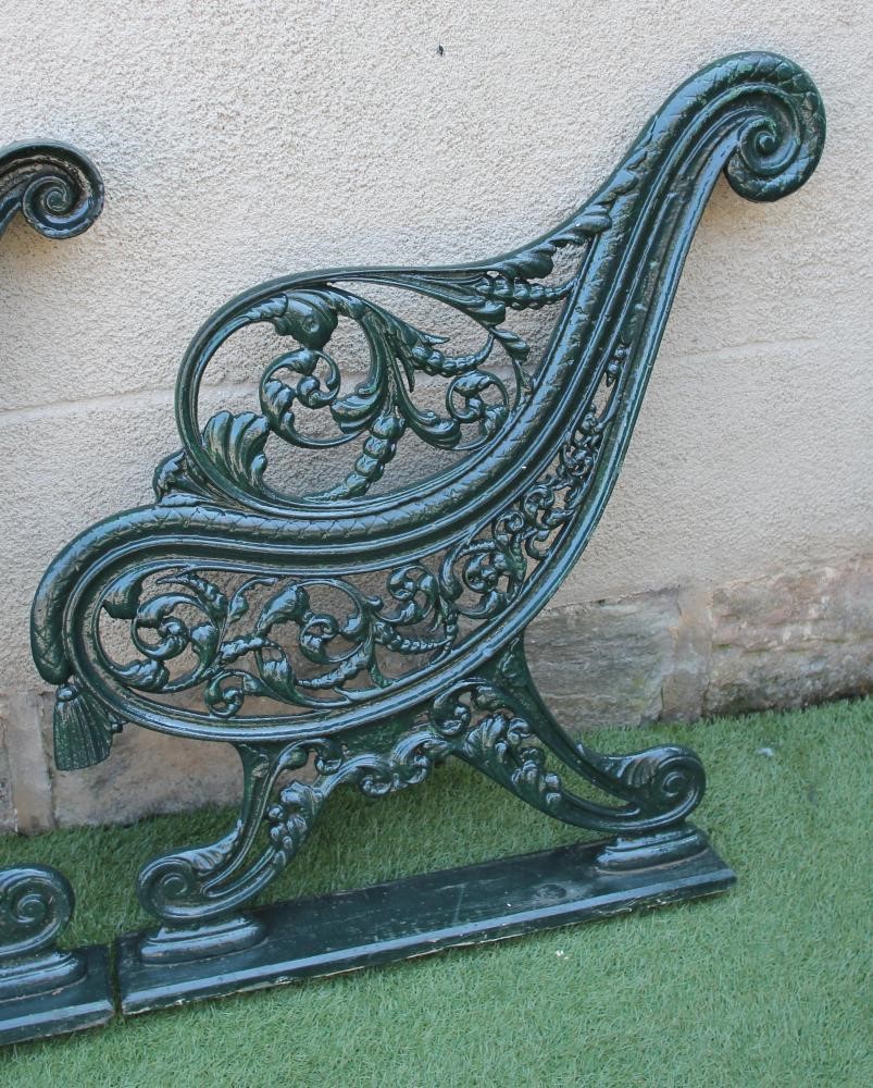 A PAIR OF VICTORIAN CAST IRON GARDEN BENCH ENDS of open scroll back form Image