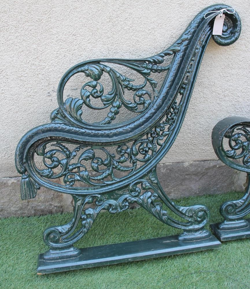 A PAIR OF VICTORIAN CAST IRON GARDEN BENCH ENDS of open scroll back form Image