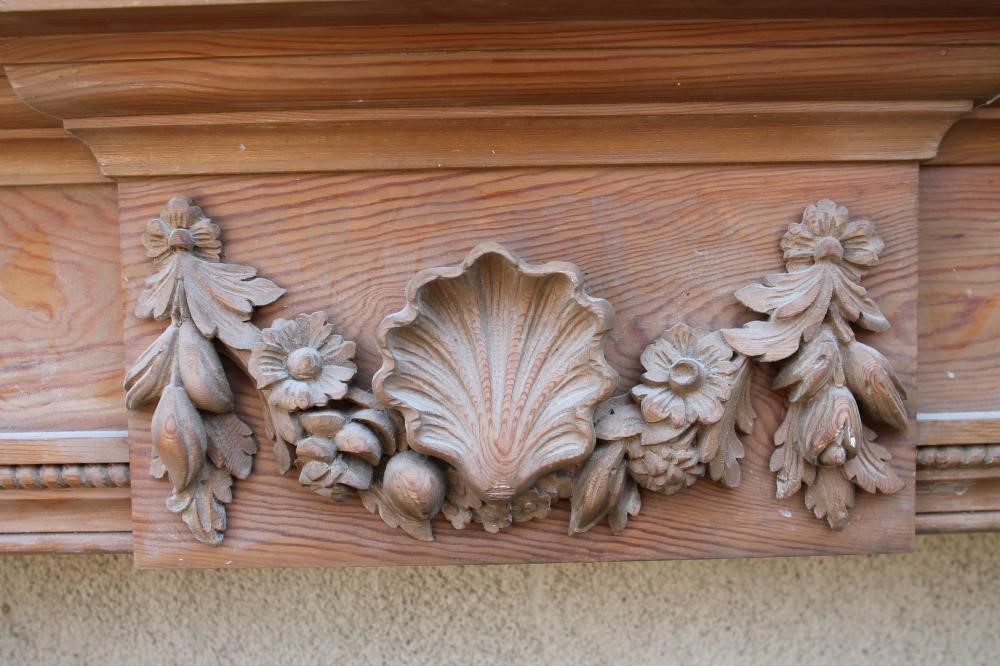 A CARVED PINE CHIMNEY PIECE of Georgian design Image