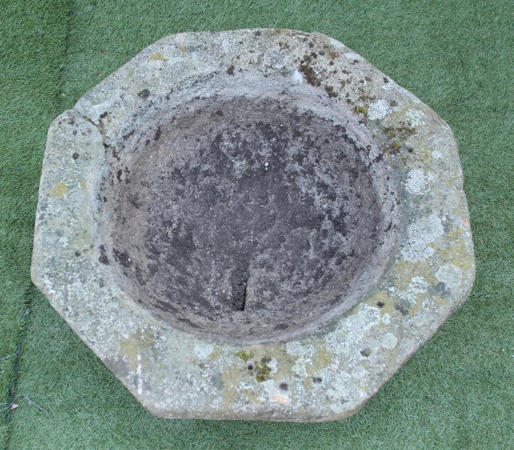 A COMPOSITION STONE PLANT TROUGH of octagonal form with moulded tapering body Image