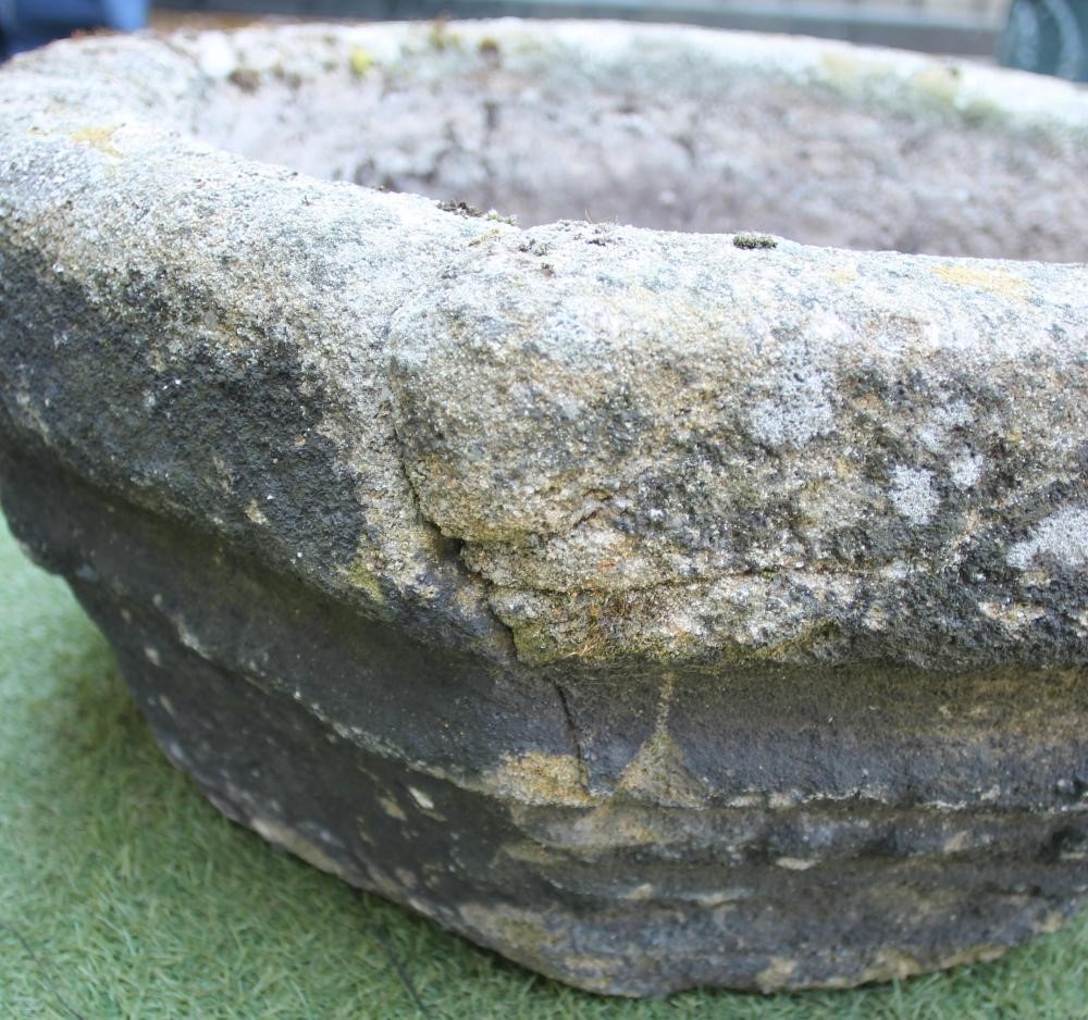A COMPOSITION STONE PLANT TROUGH of octagonal form with moulded tapering body Image