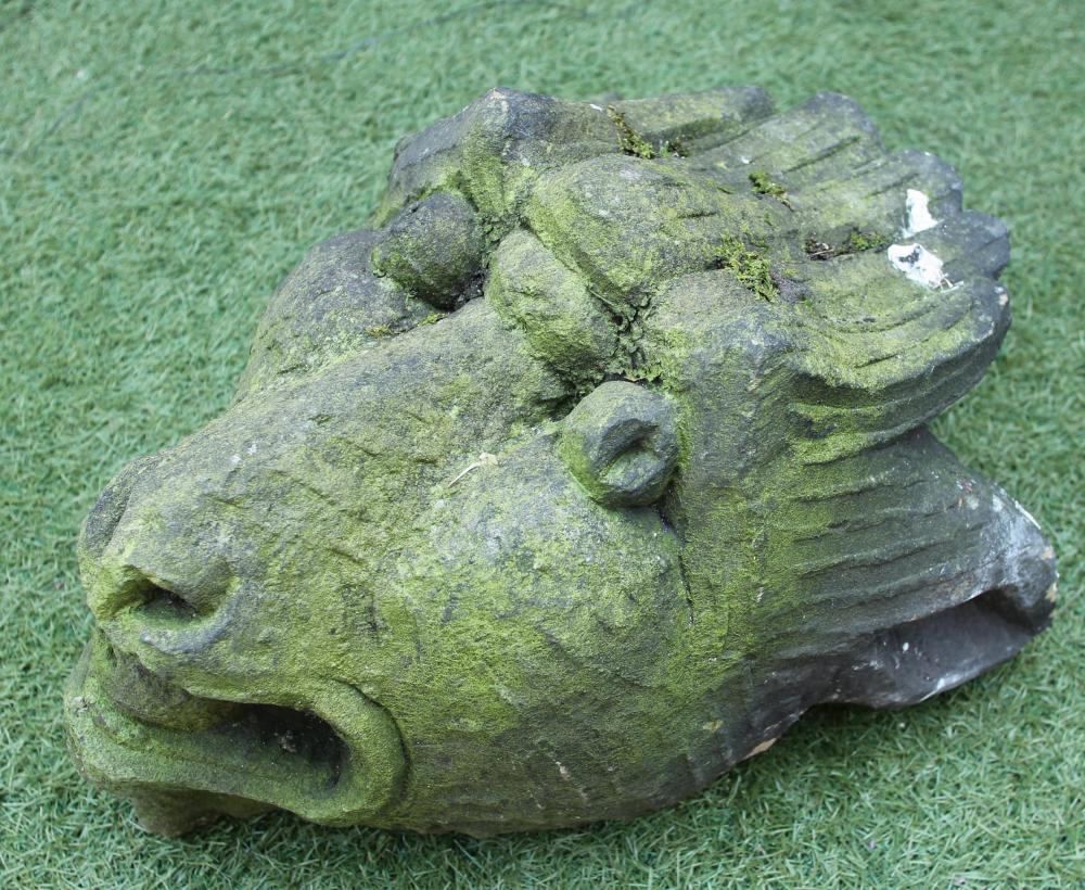 A CARVED SANDSTONE GROTESQUE MASK Image