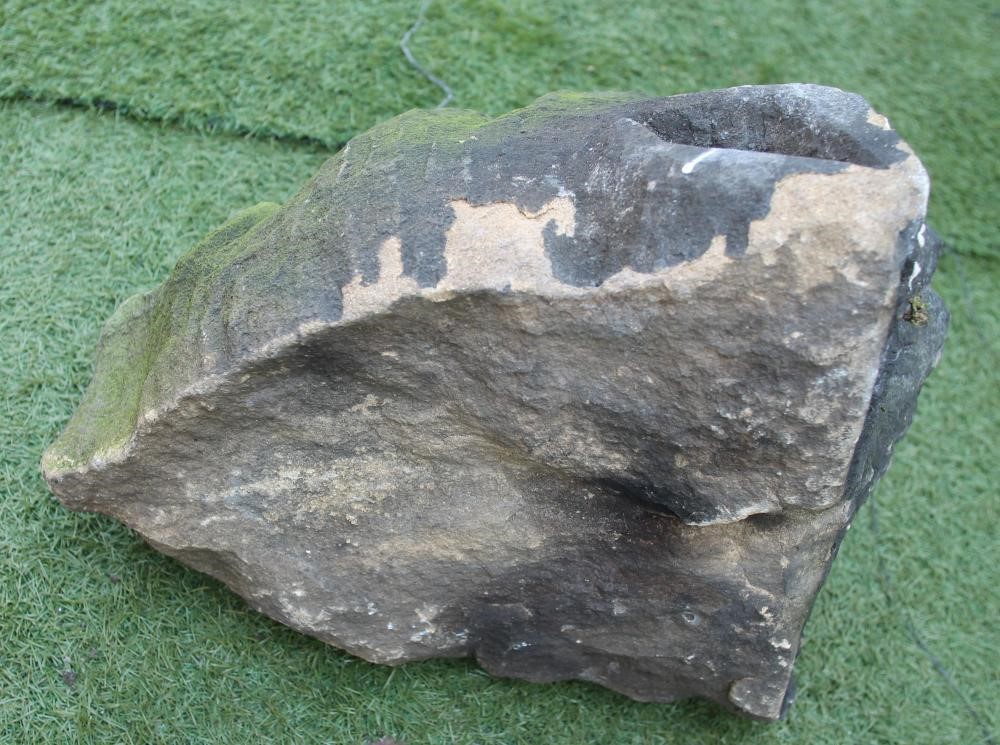 A CARVED SANDSTONE GROTESQUE MASK Image